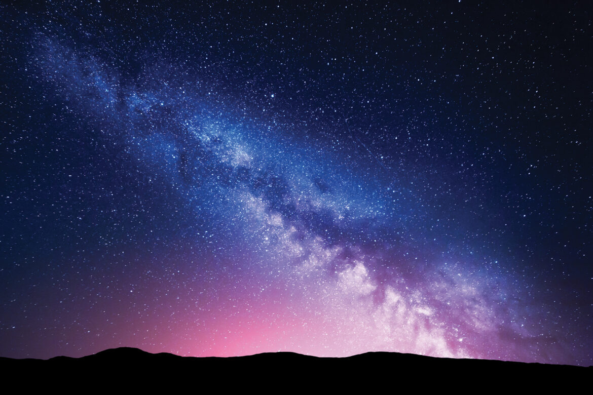Milky,Way,And,Pink,Light,At,Mountains.,Night,Colorful,Landscape.